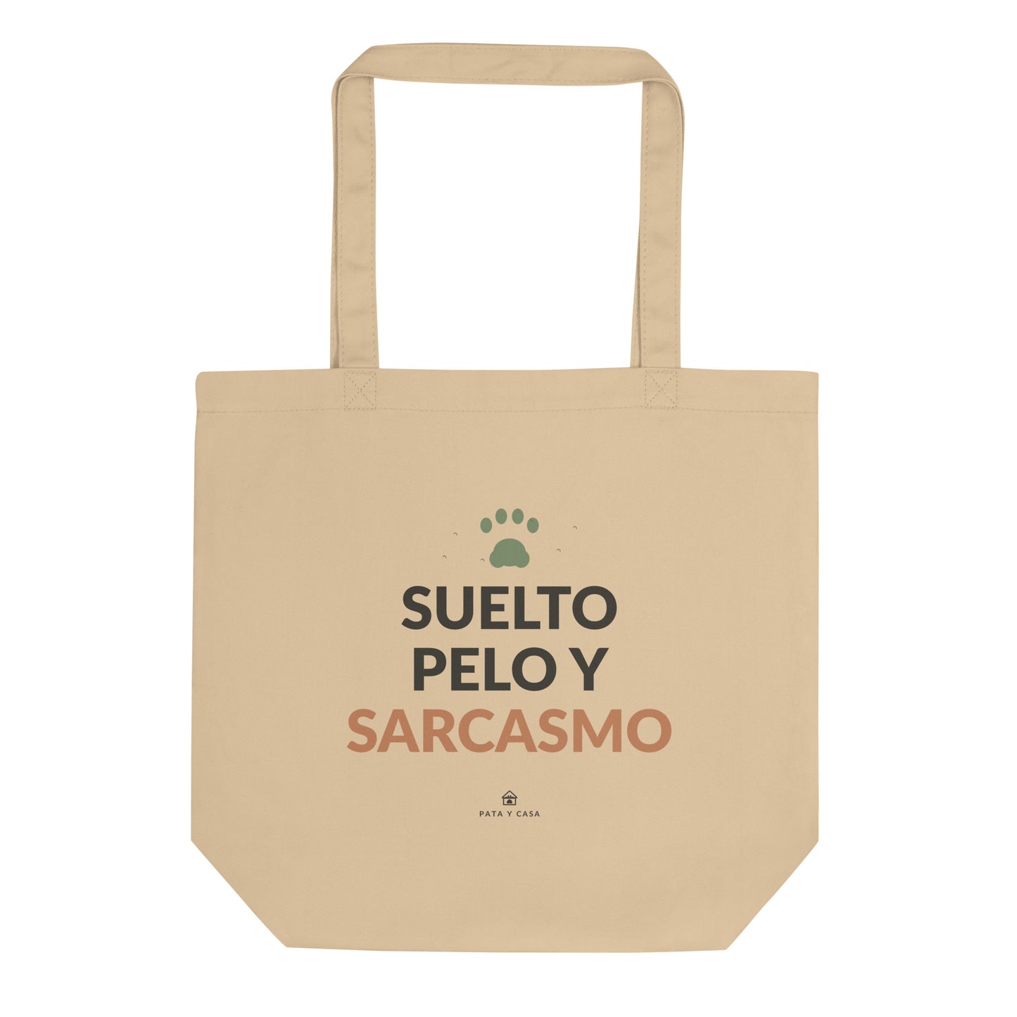 Tote bag color crudo Suelto Pelo y Sarcasmo, vista frontal con estampado negro y terracota