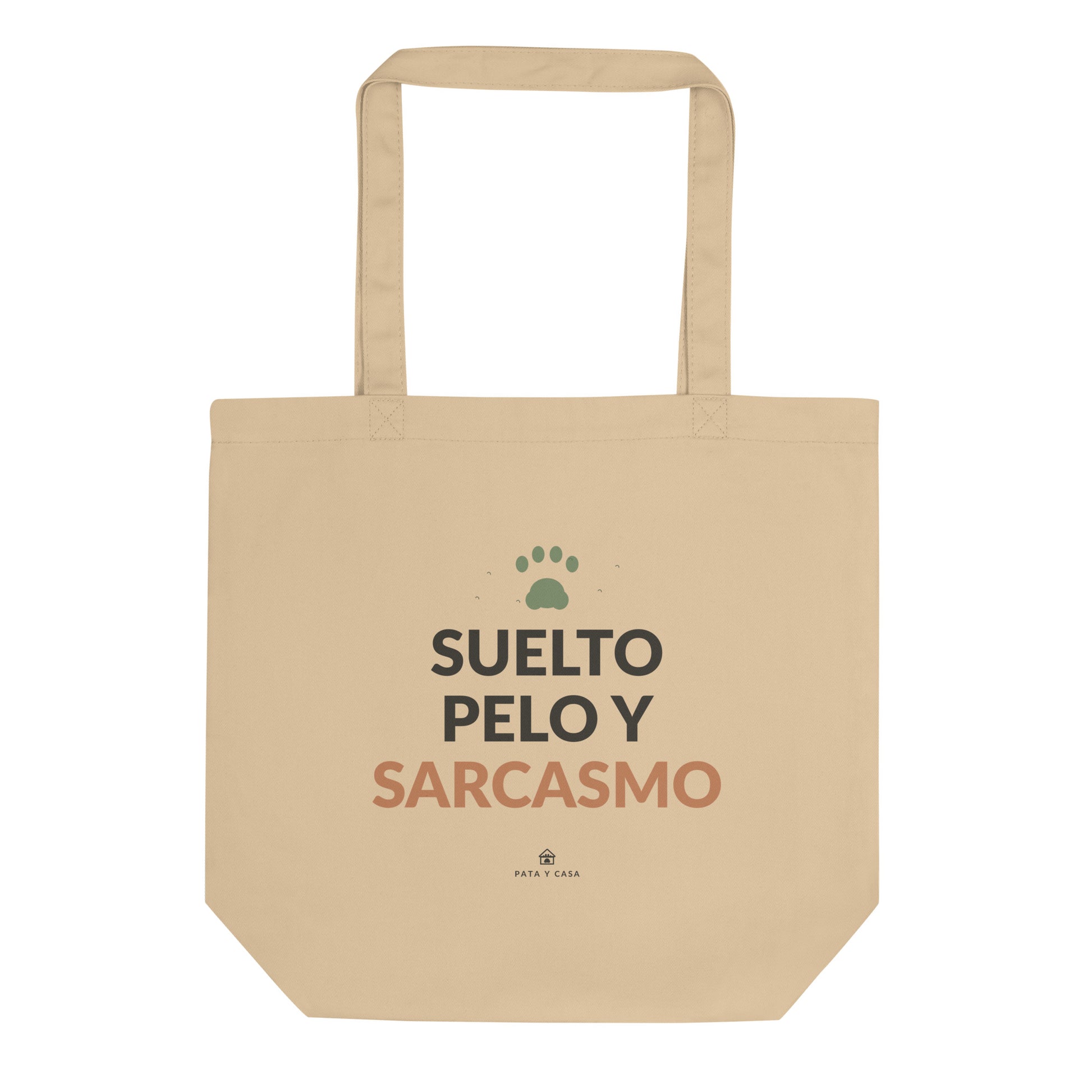 Tote bag color crudo Suelto Pelo y Sarcasmo, vista frontal con estampado negro y terracota