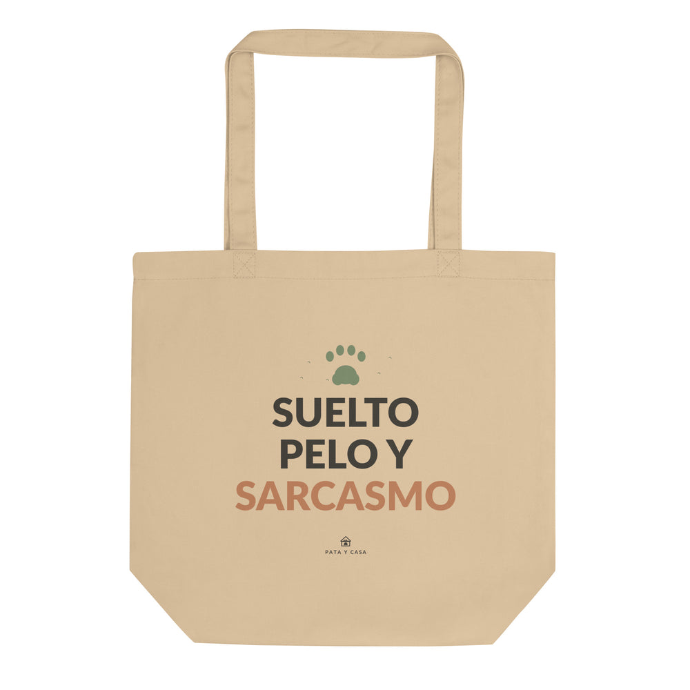 Tote de algodón orgánico color crudo con el mensaje Suelto Pelo y Sarcasmo, vista frontal