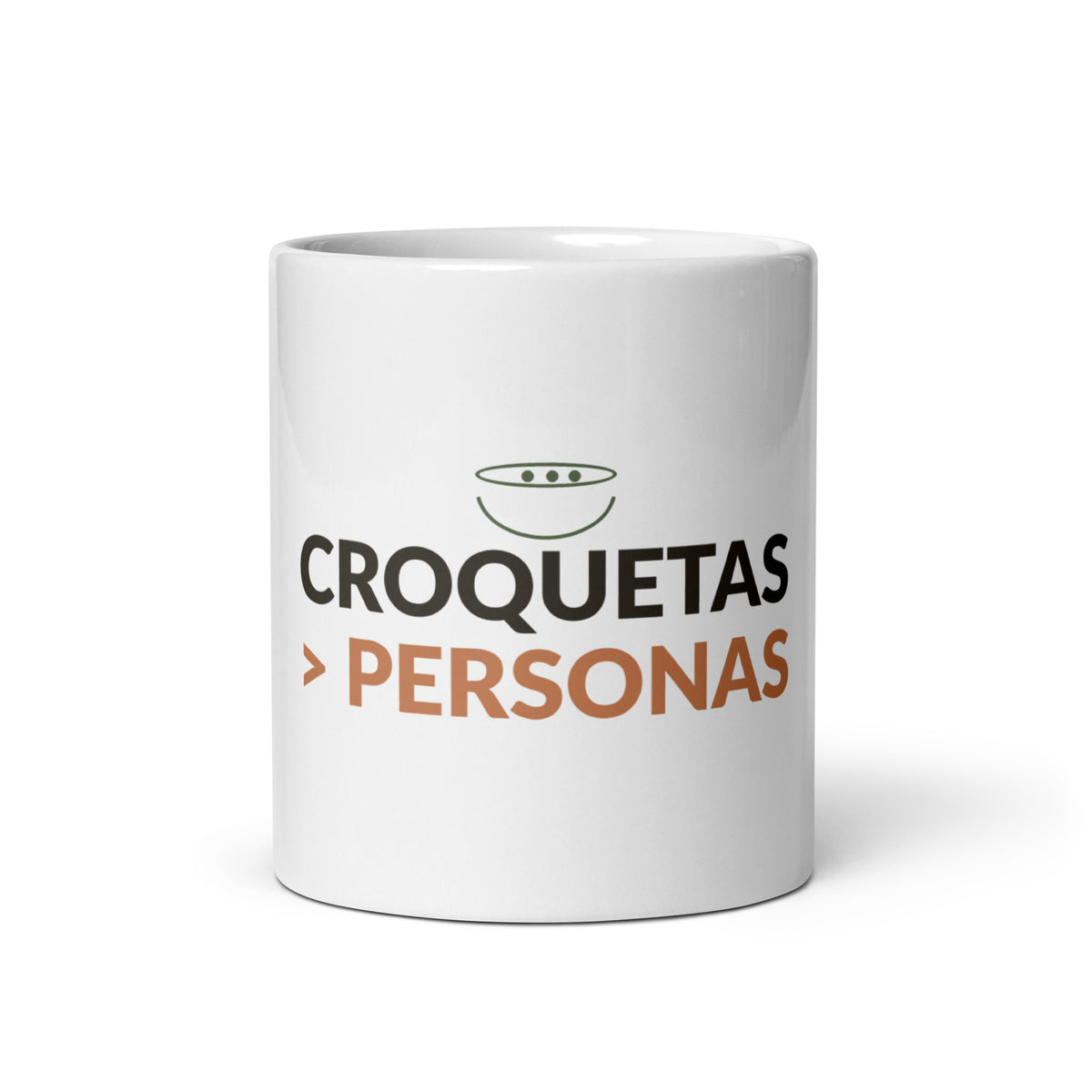Taza blanca de cerámica con el lema «Croquetas > Personas», vista frontal